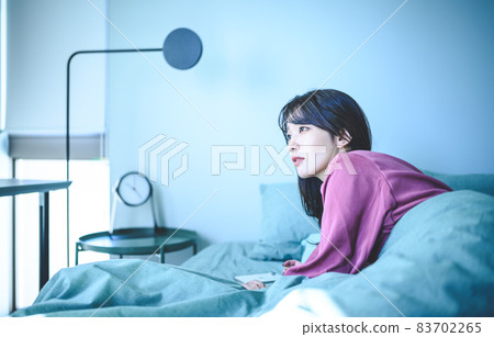 A woman in the bedroom A woman in the bedroom 83702265