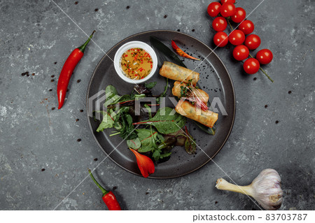 Spring rolls with shrimp with sweet chili sauce. Asian cuisine Spring rolls with shrimp with sweet chili sauce. Asian cuisine 83703787