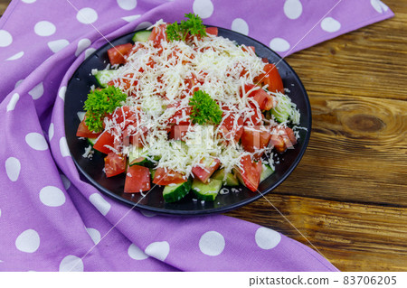 Traditional Bulgarian Shopska salad on wooden table Traditional Bulgarian Shopska salad on wooden table 83706205