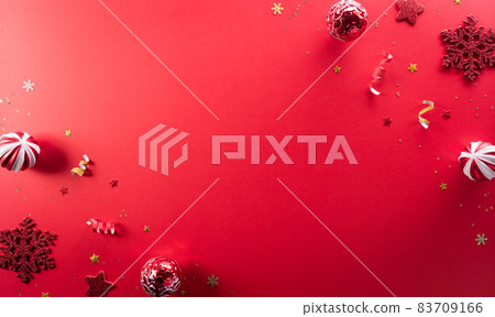 Christmas and new year background concept. Top view of Christmas ball and snowflake on red background. Christmas and new year background concept. Top view of Christmas ball and snowflake on red background. 83709166