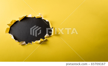 Top view of yellow torn paper on blackboard background. Black Friday composition. 83709167