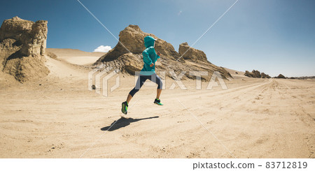 Fitness woman trail runner cross country running on desert Fitness woman trail runner cross country running on desert 83712819