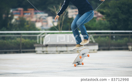 Skateboarder skateboarding outdoors in city Skateboarder skateboarding outdoors in city 83712998