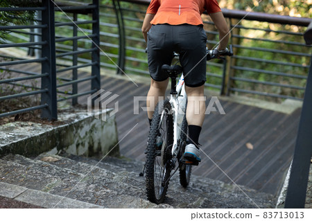 Woman riding down stairs. Sports extreme and active lifestyle 83713013