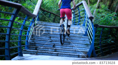 Woman freerider riding up stairs. Sports extreme and active lifestyle 83713028