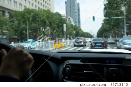 Driving car in modern city Driving car in modern city 83713140