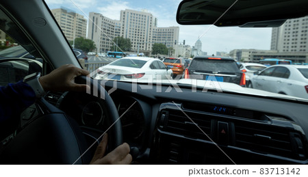 Driving car in modern city Driving car in modern city 83713142