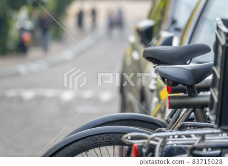 Parked Bicycles With Defocused Background Parked Bicycles With Defocused Background 83715028