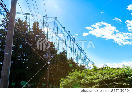Ball-proof net and blue sky at the driving range Ball-proof net and blue sky at the driving range 83715090