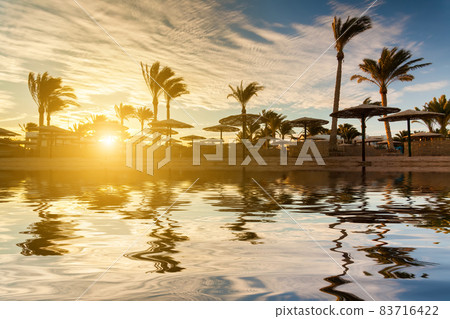 Beautiful sunset on a sandy beach at the Red Sea. Egypt, Sharm el-Sheikh. 83716422