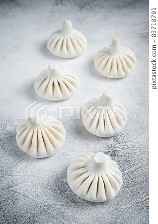 Georgian Raw dumpling Khinkali with meat. White background. Top view Georgian Raw dumpling Khinkali with meat. White background. Top view 83718791