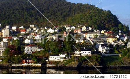 Norway on a cruise ship to the port of Bergen at dawn 83721212