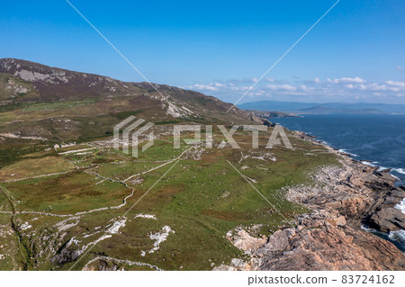 Aerial view of the coastal single track road between Meenacross and Crohy Head south of Dungloe, County Donegal - Ireland 83724162