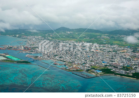 Aerial view of Ishigaki city area before landing at Ishigaki Airport 83725150