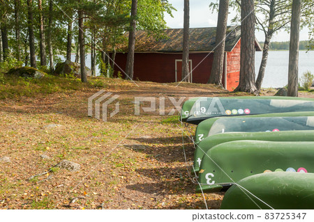 KOUVOLA, FINLAND - SEPTEMBER 20, 2018: Boats on the territory of Anjala manor. KOUVOLA, FINLAND - SEPTEMBER 20, 2018: Boats on the territory of Anjala manor. 83725347