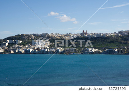 MELLIEHA, MALTA - JAN 01st, 2020: Aerial view of Mellieha city with ocean MELLIEHA, MALTA - JAN 01st, 2020: Aerial view of Mellieha city with ocean 83725893