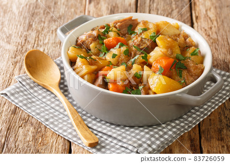 Stovies are a scottish favourite made with potatoes, onions and carrots close up in the pot. Horizontal Stovies are a scottish favourite made with potatoes, onions and carrots close up in the pot. Horizontal 83726059