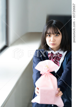 High school girls giving presents High school girls giving presents 83726667