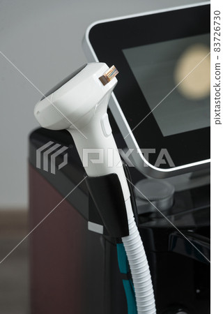 Modern equipment for laser hair removal in a beauty salon. Beauty salon and cosmetology 83726730