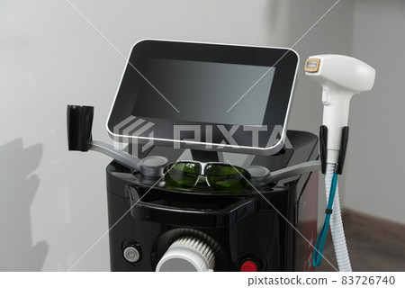 Modern equipment for laser hair removal in a beauty salon. Beauty salon and cosmetology Modern equipment for laser hair removal in a beauty salon. Beauty salon and cosmetology 83726740