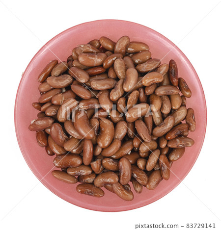 Tinned beans in red bowl on white background. Studio Photo 83729141