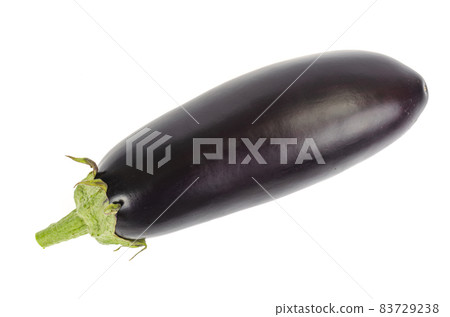 Ripe black purple eggplant with a green tail on a white background. Ripe black purple eggplant with a green tail on a white background. 83729238