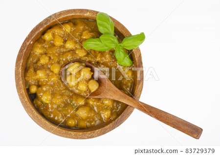 Chickpeas with curry sauce in wooden bowl. Studio Photo 83729379