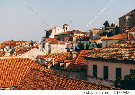 Facade of the church of Saint Ignatius in Dubrovnik, Croatia. Statue of an angel above the entrance to the church. 83729425