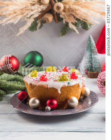 Artisanal Italian christmas cake with sweet decor and xmas ornament Artisanal Italian christmas cake with sweet decor and xmas ornament 83729867
