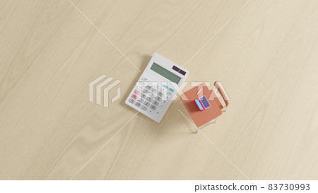 Miniature school desk and calculator placed on a flat surface 83730993