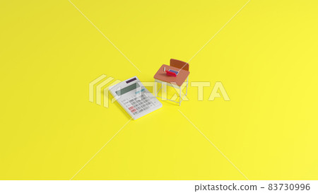 Miniature school desk and calculator placed on a flat surface 83730996