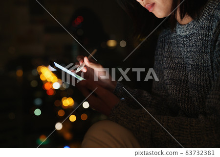 Using stylus pen on digital tablet at night, lifestyle at night Using stylus pen on digital tablet at night, lifestyle at night 83732381