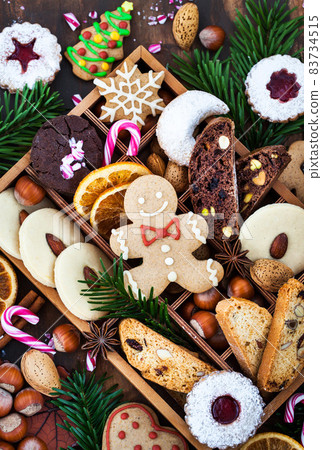 Sweet Christmas cookies in wooden box on rustic table 83734515