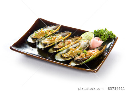 Garlic mussels in a plate on white background. Garlic mussels in a plate on white background. 83734611