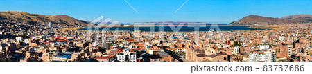 Panorama of Puno with Lake Titicaca in Peru 83737686