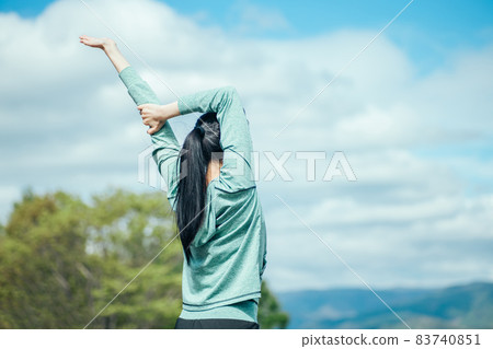 Woman stretching (back view) 83740851