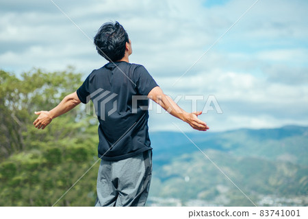 A man taking a deep breath (back view) A man taking a deep breath (back view) 83741001