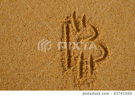Bitcoin sign written on sand in evening sunlight Bitcoin sign written on sand in evening sunlight 83741089
