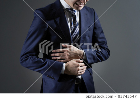 Businessman abdominal pain Businessman abdominal pain 83743547