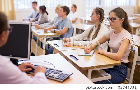Teenage students working at class during lesson Teenage students working at class during lesson 83744331