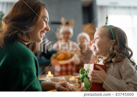 family celebrating Christmas 83745000