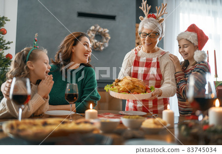 family celebrating Christmas family celebrating Christmas 83745034