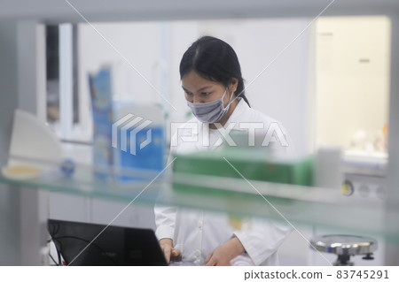 Asian woman scientist working on laptop in the laboratory Asian woman scientist working on laptop in the laboratory 83745291