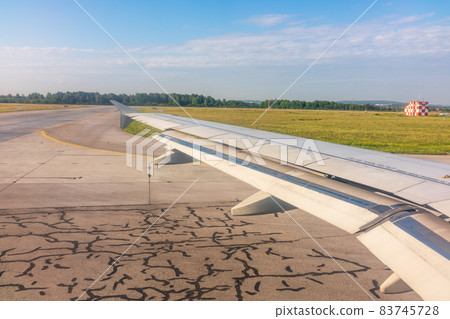 View from the airplane window during taking off on a clear summer morning. SVX, Yekaterinburg, Russia View from the airplane window during taking off on a clear summer morning. SVX, Yekaterinburg, Russia 83745728