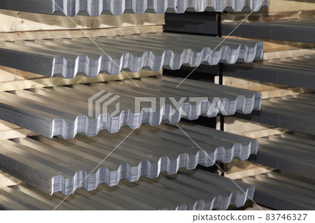 Profiled galvanized sheet in packs at the metal products warehouse 83746327