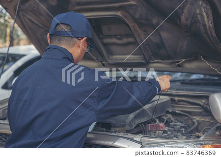 Mechanic car service auto garage in automotive mobile center. Technician workshop repair engine motor vehicles service mechanical engineering business. Automobile mechanic hands car repairs technic Mechanic car service auto garage in automotive mobile center. Technician workshop repair engine motor vehicles service mechanical engineering business. Automobile mechanic hands car repairs technic 83746369