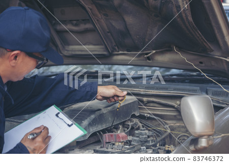 Mechanic car service auto garage in automotive mobile center. Technician workshop repair engine motor vehicles service mechanical engineering business. Automobile mechanic hands car repairs technic Mechanic car service auto garage in automotive mobile center. Technician workshop repair engine motor vehicles service mechanical engineering business. Automobile mechanic hands car repairs technic 83746372