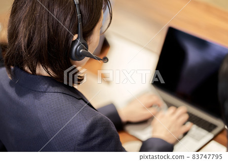 Asian business person responding at the customer center Asian business person responding at the customer center 83747795