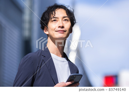 A man with a smartphone A man with a smartphone 83749140
