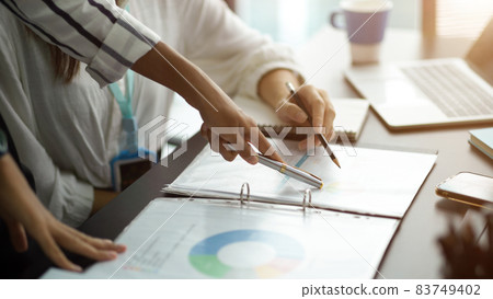 Close-up Businesspeople talk and brainstorm in office Close-up Businesspeople talk and brainstorm in office 83749402